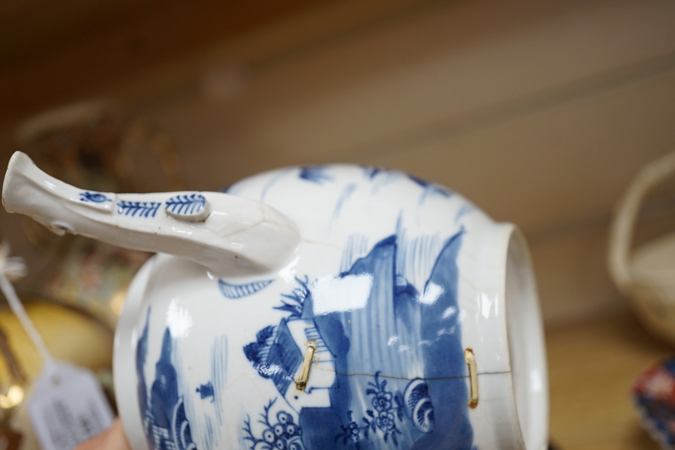 An 18th century Chinese blue and white teapot and cover, with hardwood stand, 19cm total height